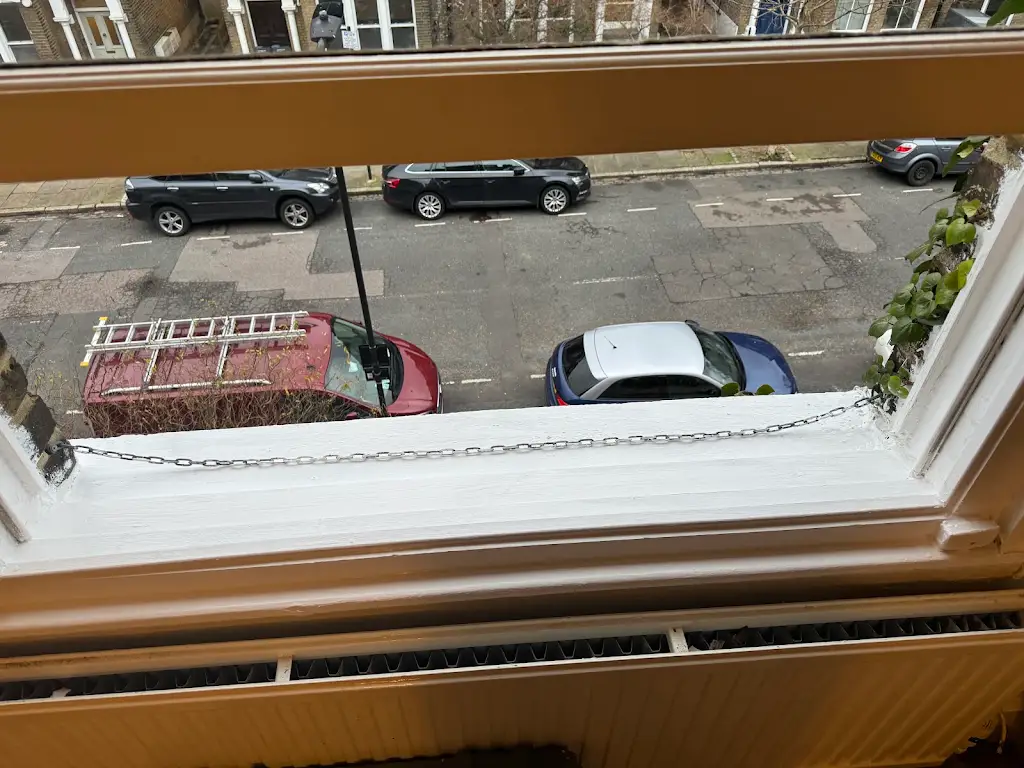 Exterior window sill freshly repainted in crisp white
