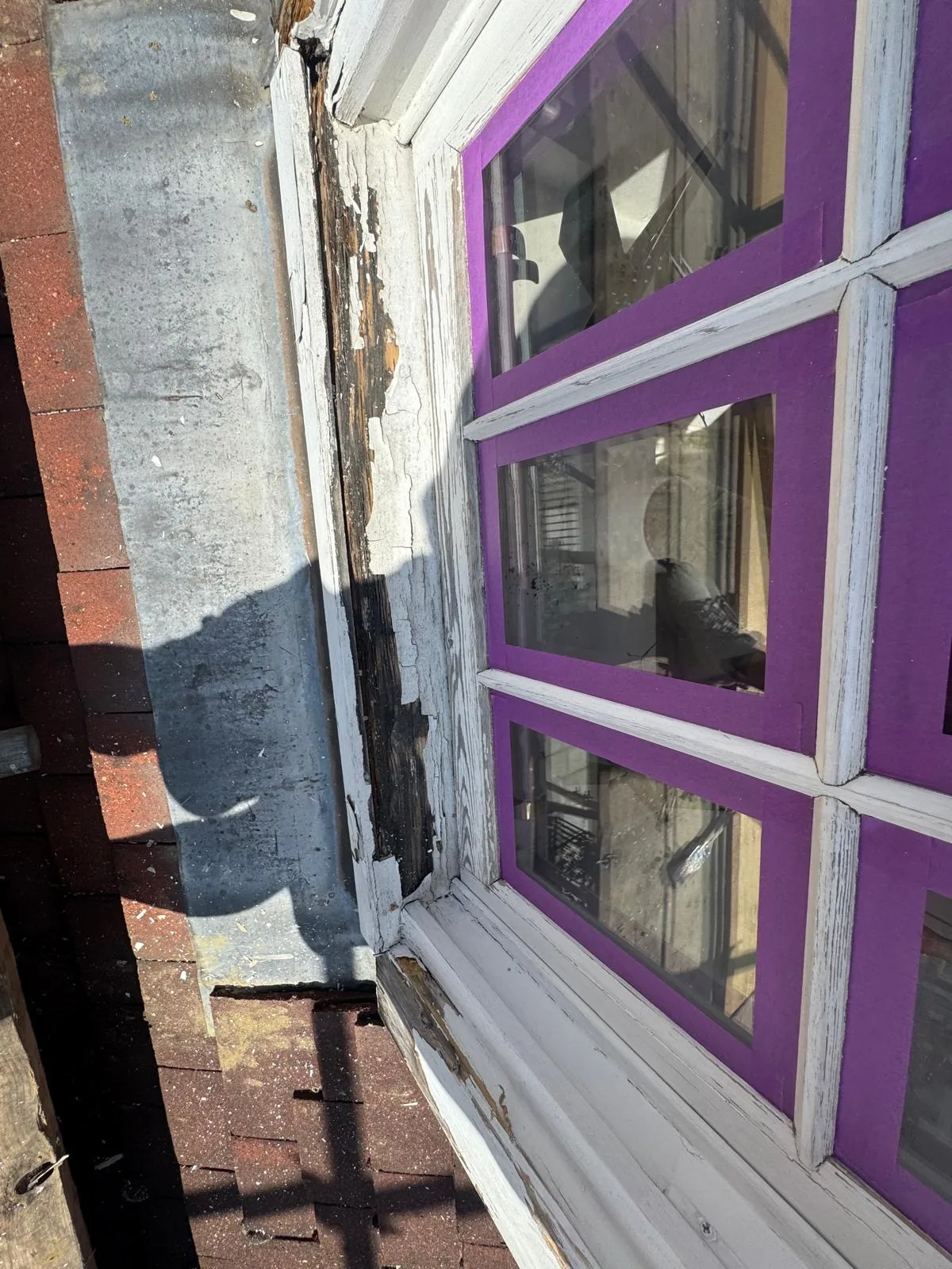 Close-up of rotted sash window frame stripped back to bare timber