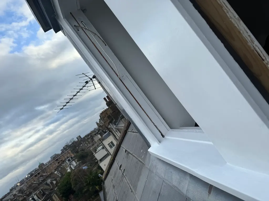 Detailed repainted sash window frame with sash cord exposed