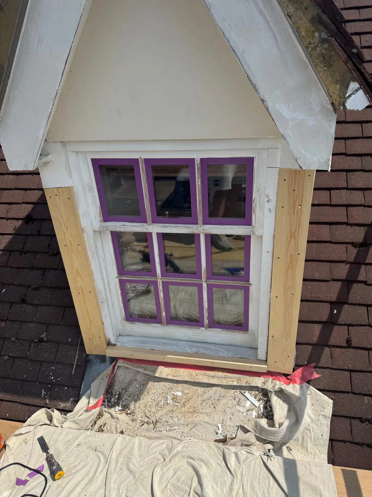 Dormer window with new hardwood trim installed before repaint