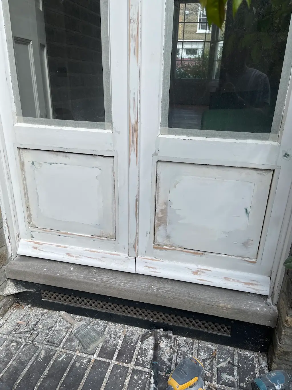 French doors stripped and primed mid-restoration