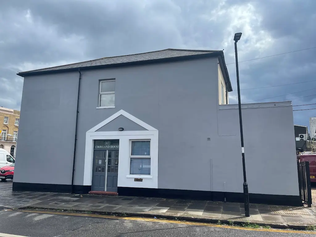 Full exterior repaint of a detached London property in grey and white