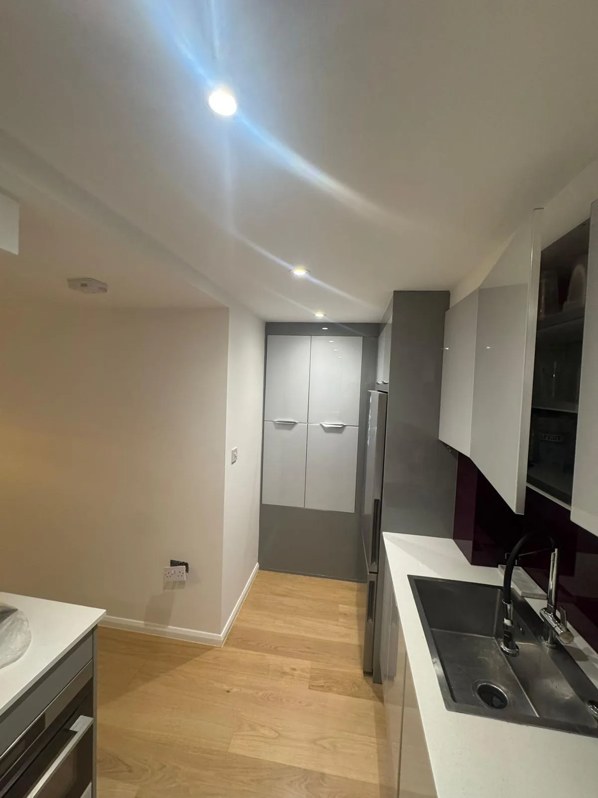 Modern kitchen with freshly painted walls and ceiling in bright white