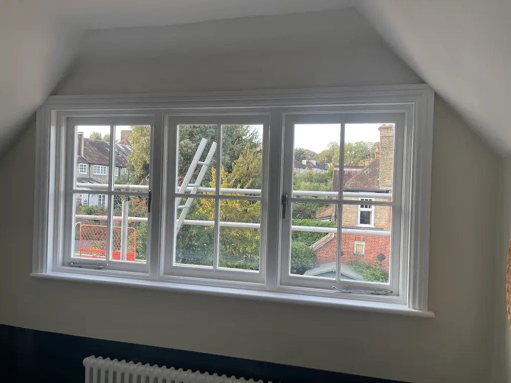 Freshly repainted sash windows in a London loft conversion