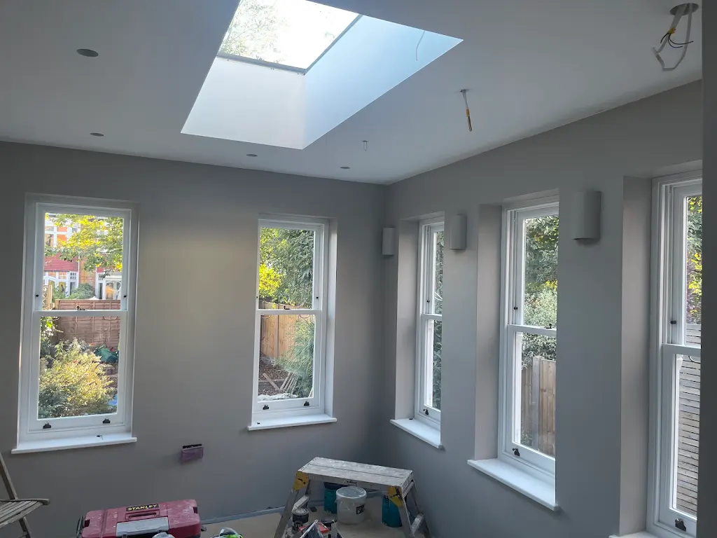 Bright loft extension with skylight and freshly painted sash windows