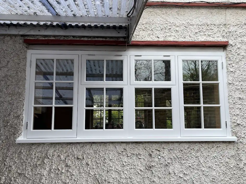 Traditional white timber cottage windows freshly repainted