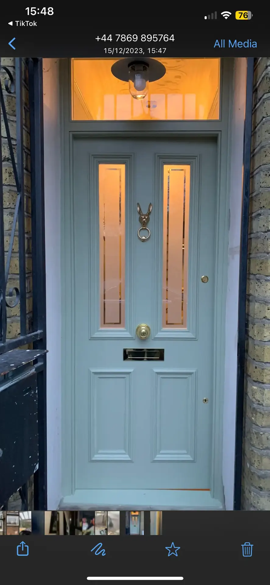 Sage green period front door with polished brass fittings