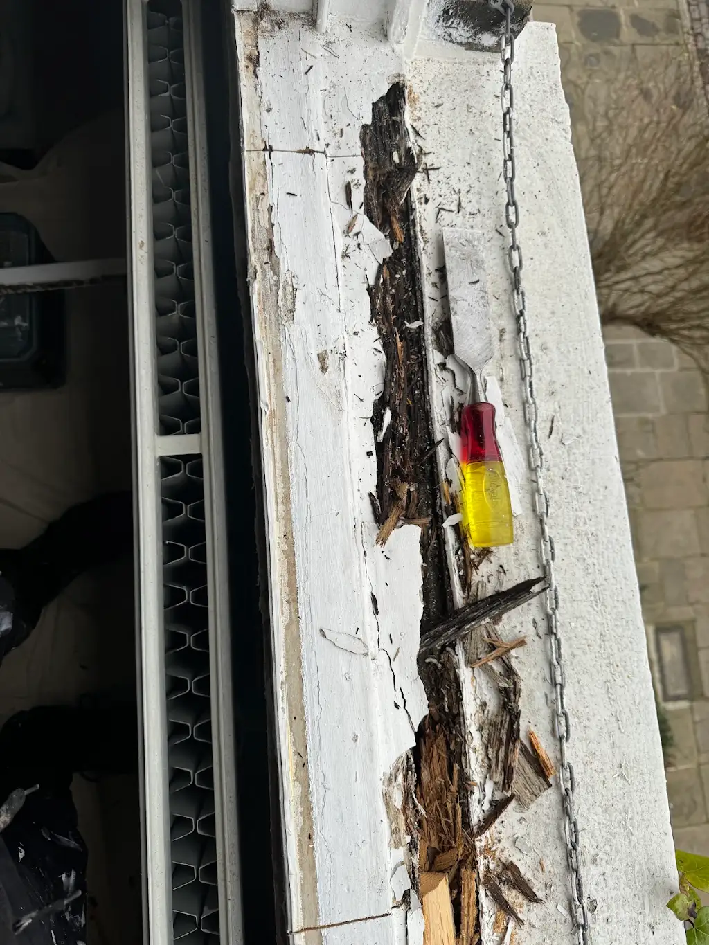 Window sill before restoration showing rotted wood